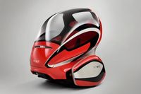 По замыслу инженеров General Motors, по улицам городов будущего будут сновать двухместные двухколесные электрические автомобили без водителя 